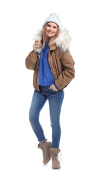 Photo of Young woman wearing warm clothes on white background. Ready for winter vacation