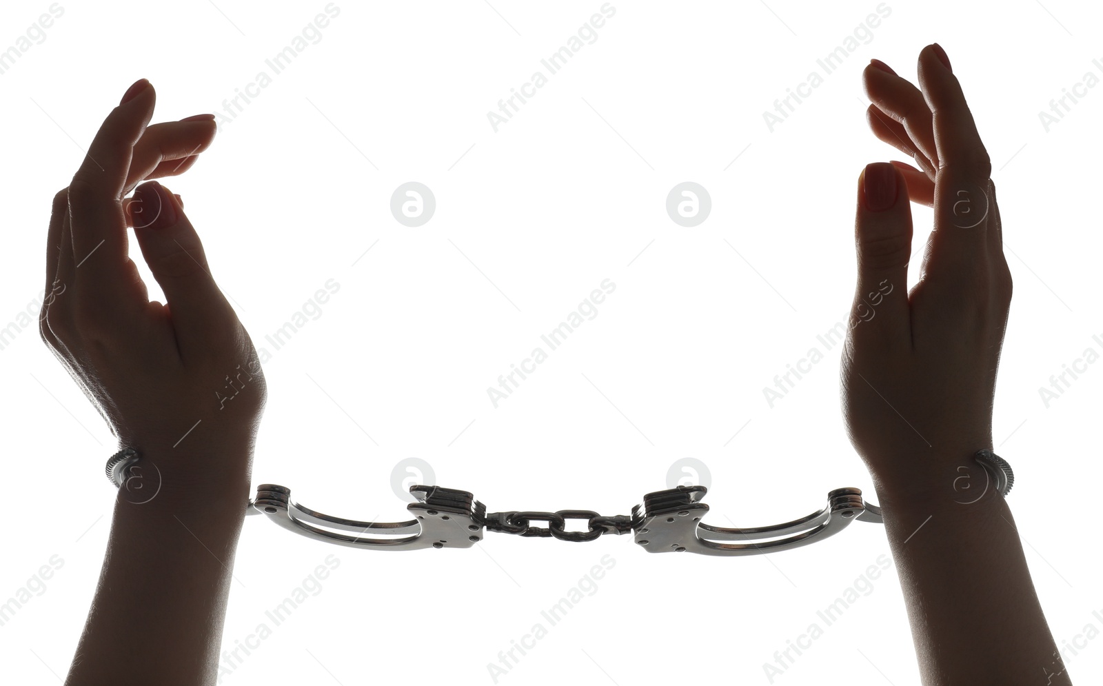 Photo of Freedom concept. Woman with handcuffs on white background, closeup