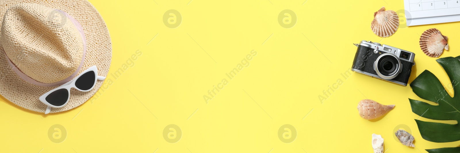 Image of Flat lay composition with vacation accessories on yellow background, space for text. Banner design