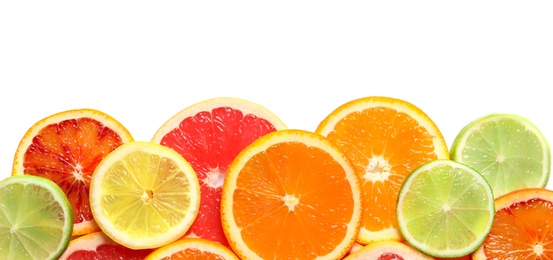 Slices of fresh citrus fruits on white background, top view