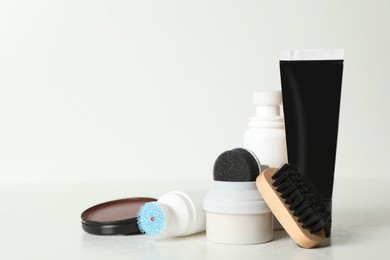 Photo of Composition with shoe care accessories on white background