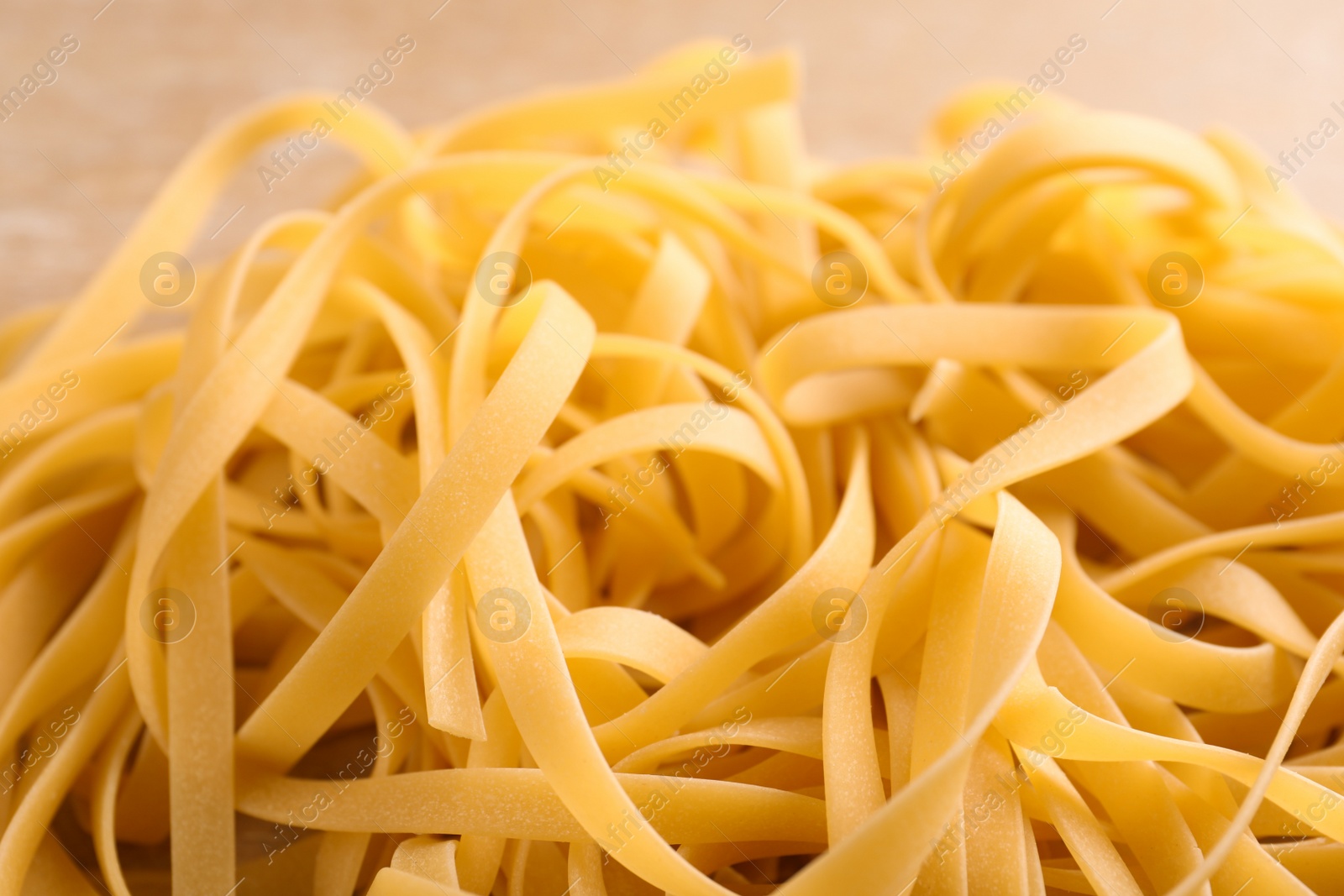 Photo of Raw egg noodles, closeup. Traditional Asian meal