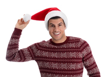 Emotional handsome man wearing Santa hat on white background