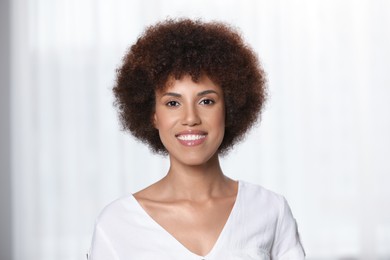 Photo of Portrait of beautiful young woman on light background