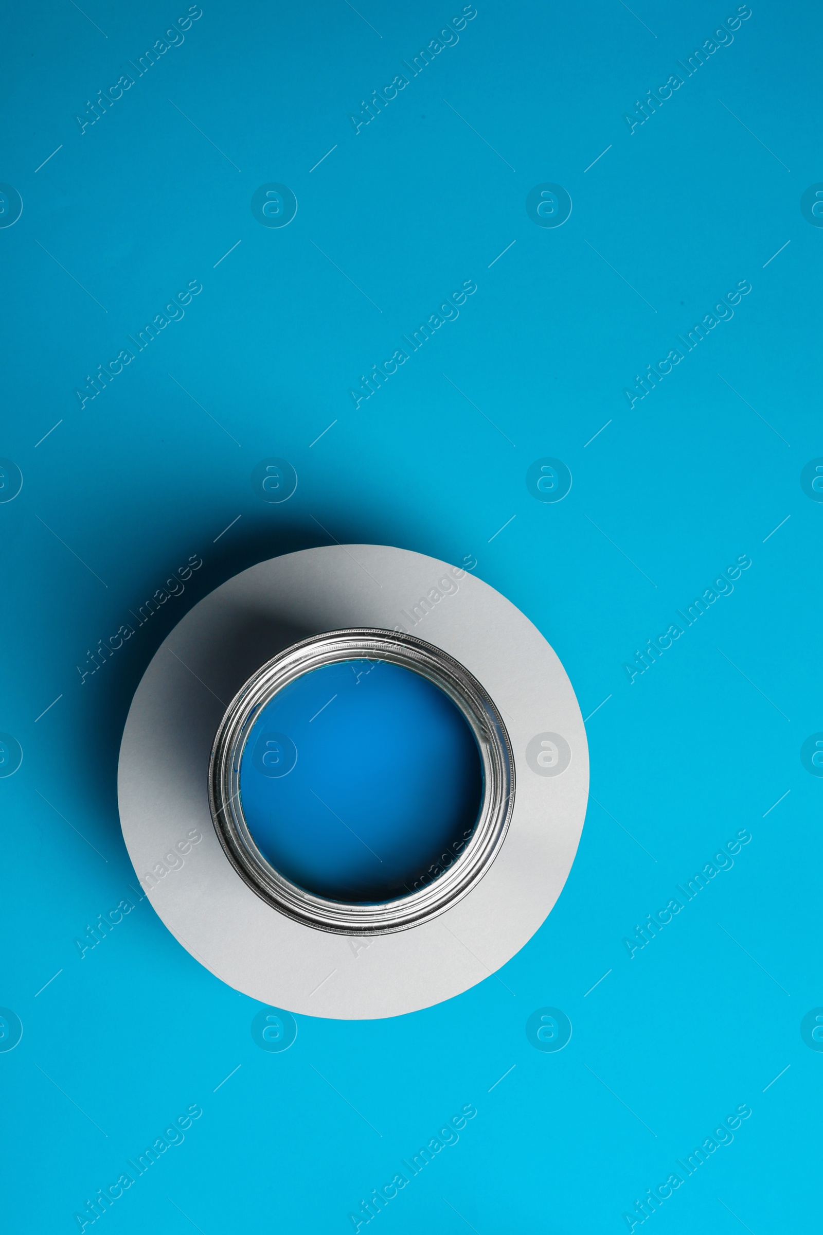 Photo of Paint can on color background, top view. Space for text