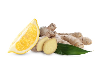 Fresh ginger root and lemon on white background