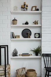 Many shelves with different decor in room. Interior design