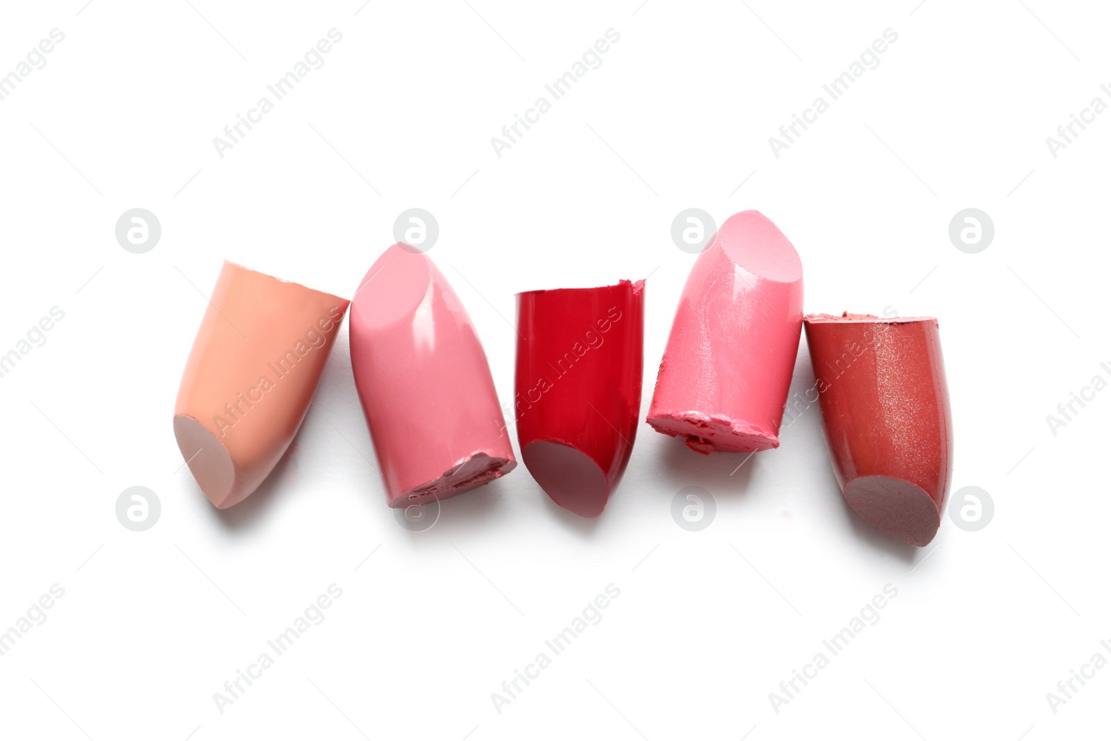 Photo of Different lipstick swatches on white background, top view