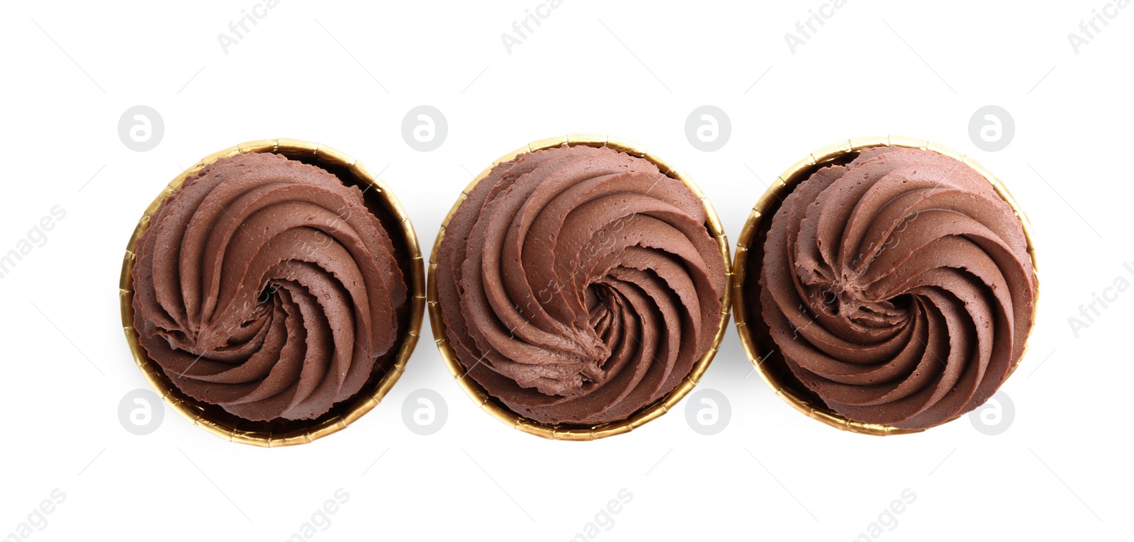 Photo of Delicious chocolate cupcakes isolated on white, top view