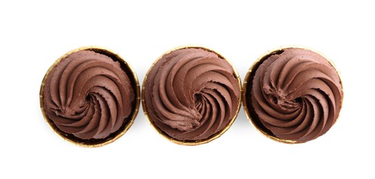 Photo of Delicious chocolate cupcakes isolated on white, top view