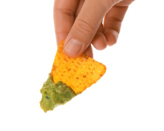 Woman holding delicious nachos chip with guacamole on white background, closeup