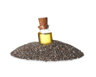 Photo of Bottle of chia oil in seeds on white background