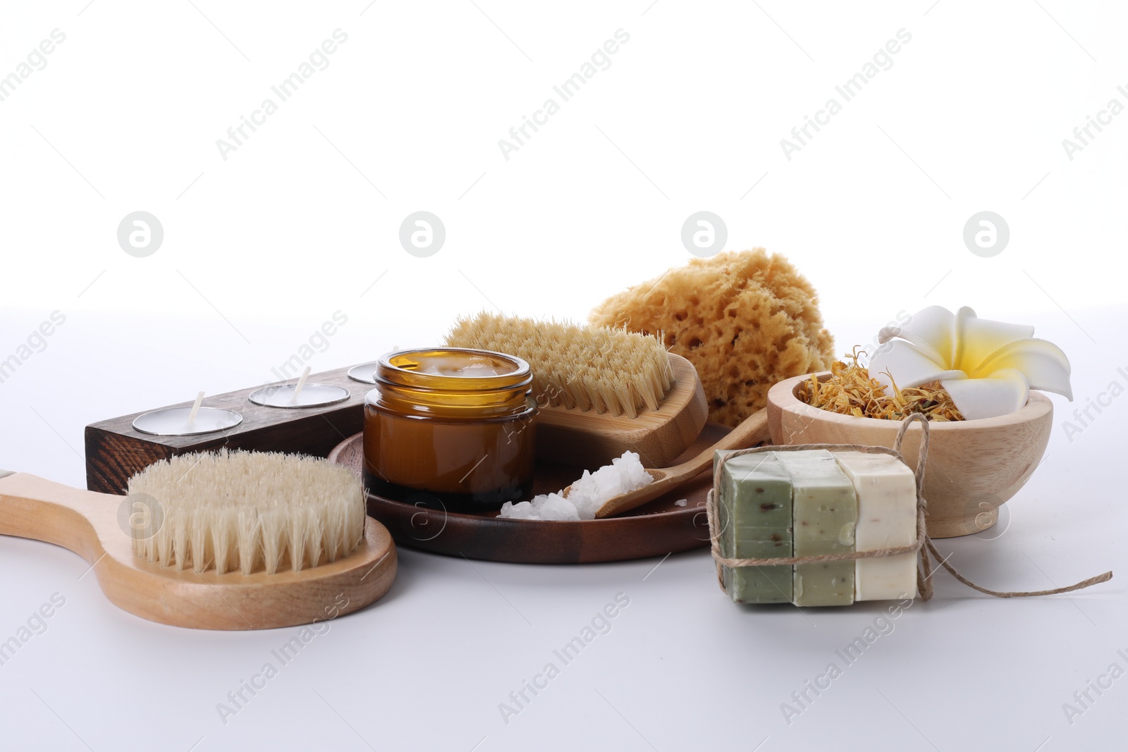 Photo of Composition with spa products and candles isolated on white