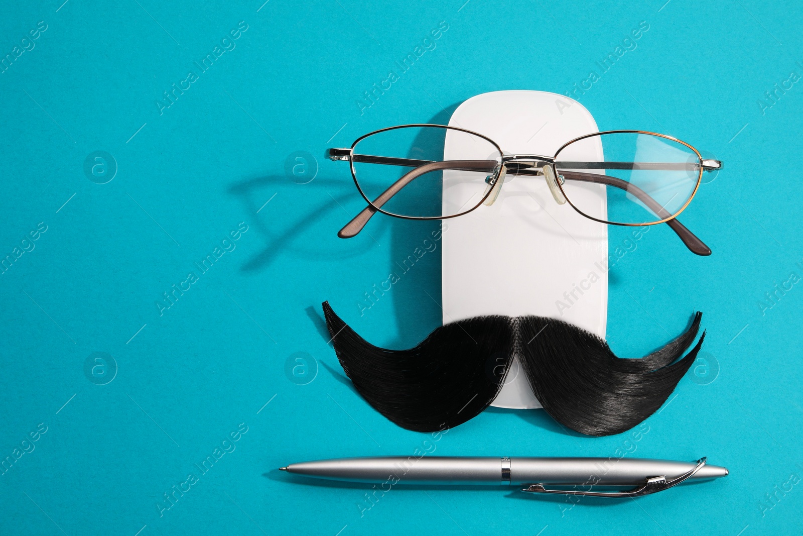 Photo of Flat lay composition with artificial moustache and glasses on light blue background, space for text