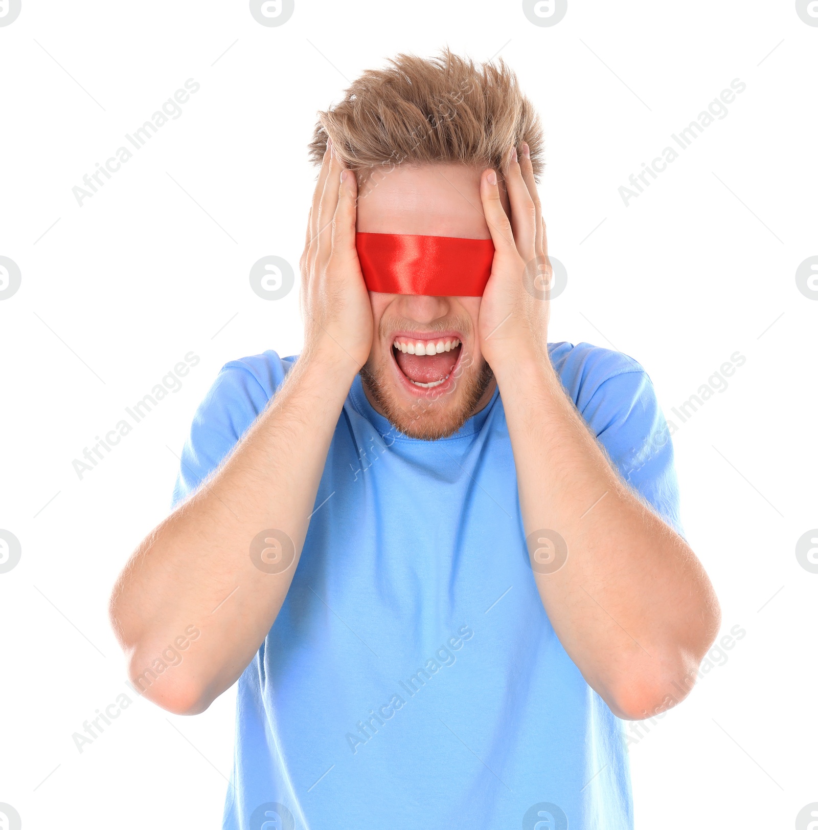 Photo of Emotional young man wearing red blindfold on white background