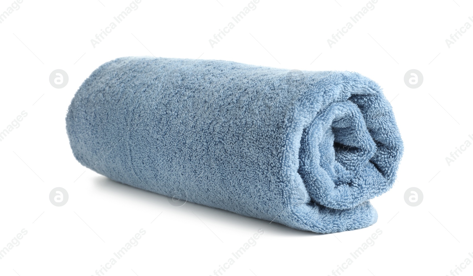 Photo of Rolled soft terry towel on white background