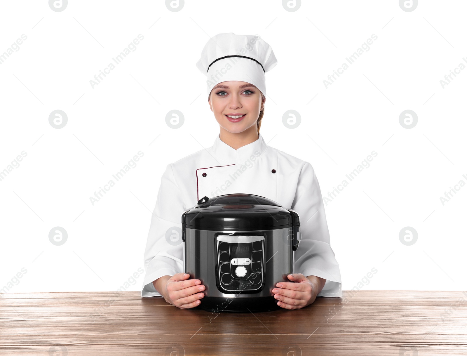 Photo of Female chef with modern multi cooker at table against white background
