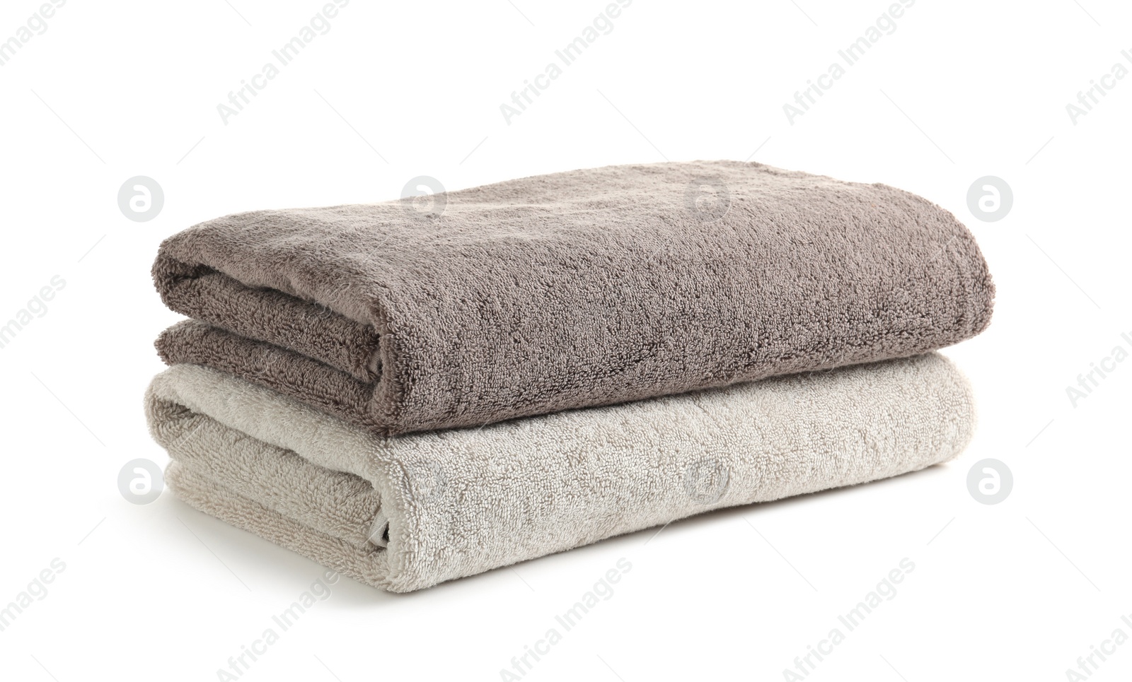 Photo of Fresh soft folded towels isolated on white