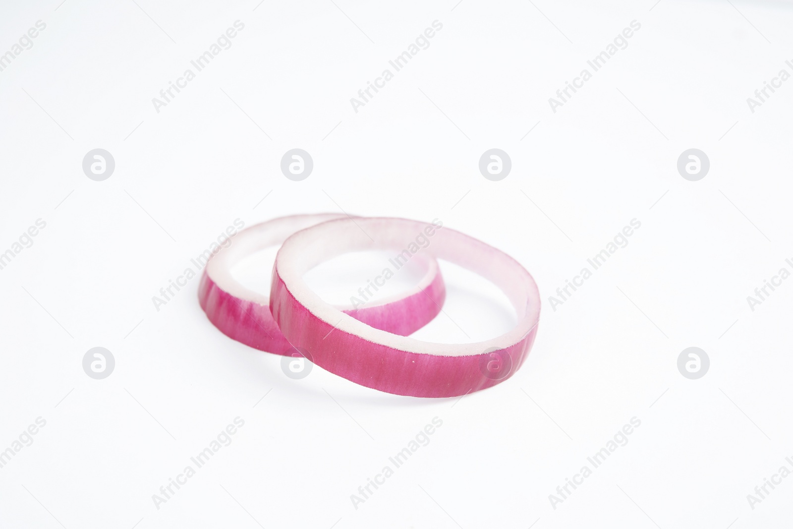 Photo of Fresh slices of red onion on white background