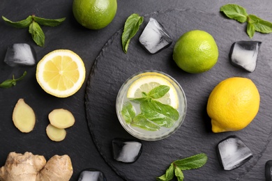 Photo of Flat lay composition with detox lemonade and ingredients on grey background