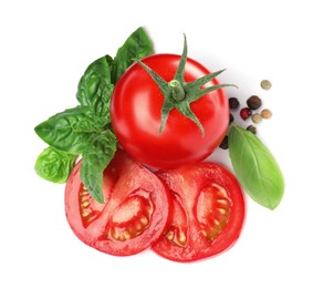 Photo of Fresh green basil leaves, spices with cut and whole tomatoes on white background