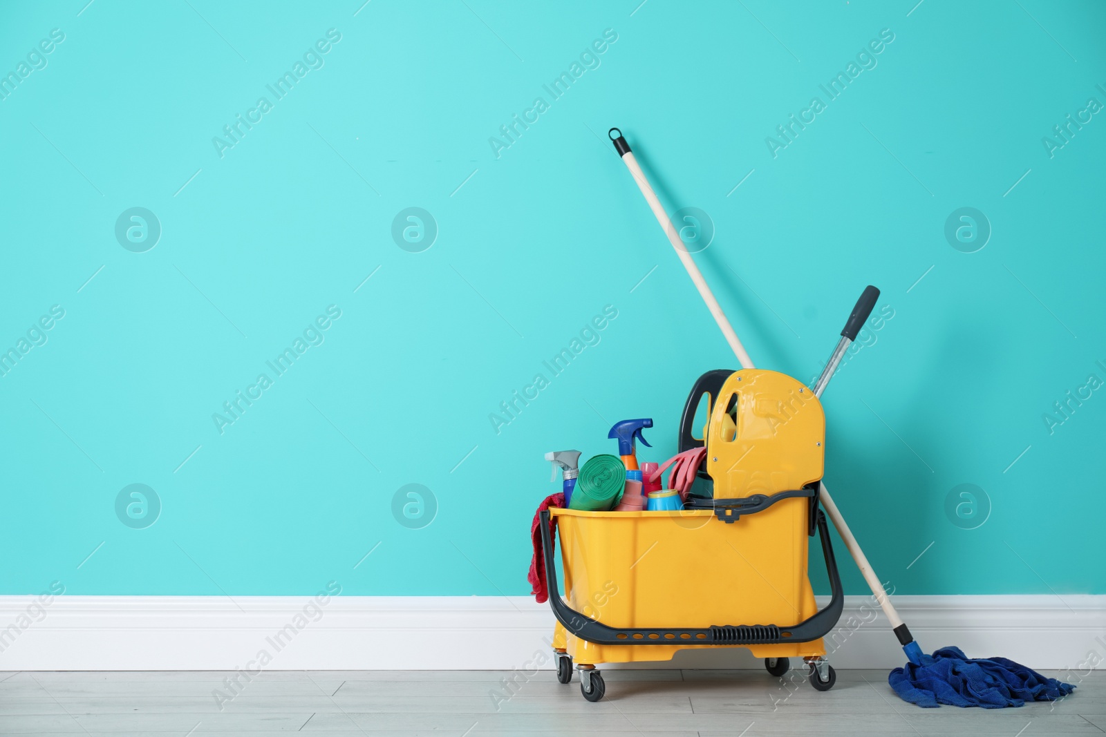 Photo of Set of cleaning supplies on floor indoors