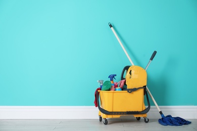 Set of cleaning supplies on floor indoors