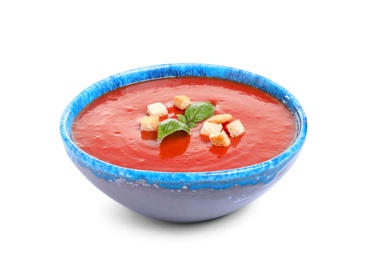 Bowl with fresh homemade tomato soup on white background