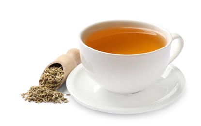 Aromatic fennel tea in cup, seeds and scoop isolated on white