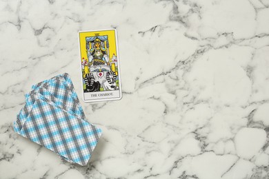 Photo of The Chariot and other tarot cards on white marble table, flat lay. Space for text