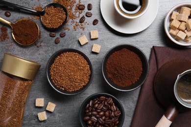 Flat lay composition with beans, instant and ground coffee on grey table