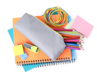 Photo of Pencil case and different school stationery on white background, top view