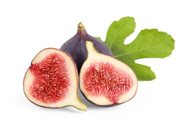 Photo of Whole and cut ripe figs with green leaf isolated on white