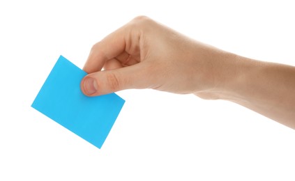 Man holding facial oil blotting tissue on white background, closeup. Mattifying wipe