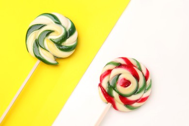 Photo of Sweet lollipops on color background, flat lay