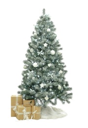 Decorated Christmas tree with faux fur skirt and gift boxes on white background