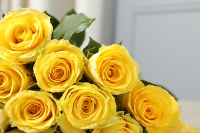 Beautiful bouquet of yellow roses against blurred background, closeup