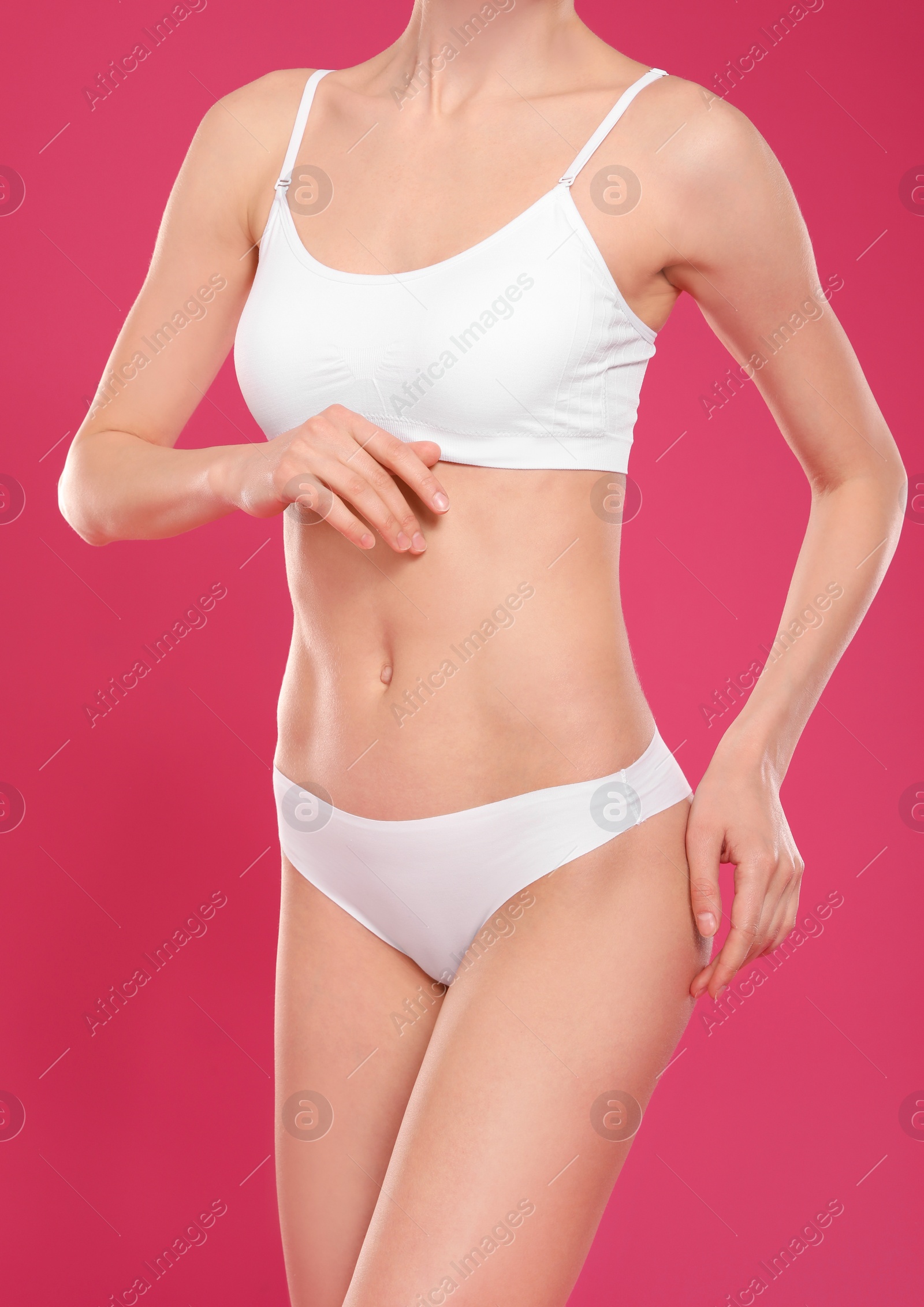 Photo of Slim young woman with smooth gentle skin on color background. Beauty and body care concept