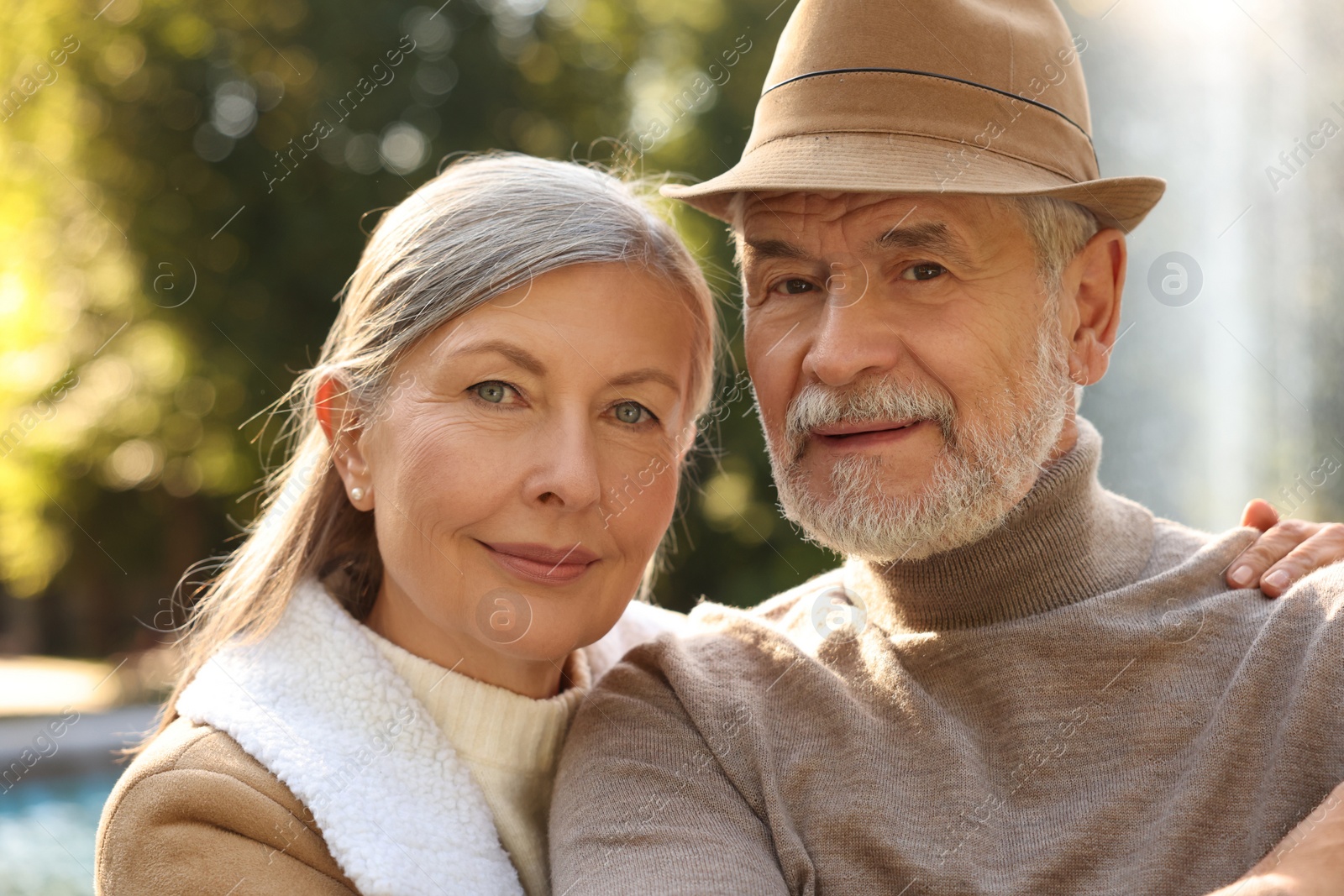 Photo of Portrait of affectionate senior couple outdoors. Romantic date