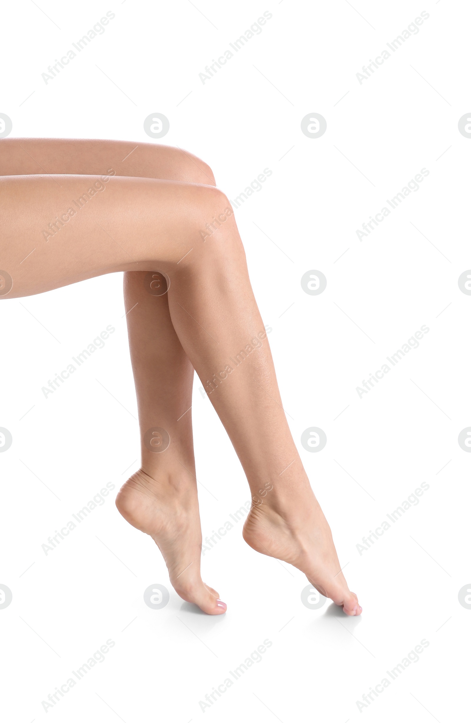 Photo of Woman with beautiful legs and feet on white background, closeup. Spa treatment