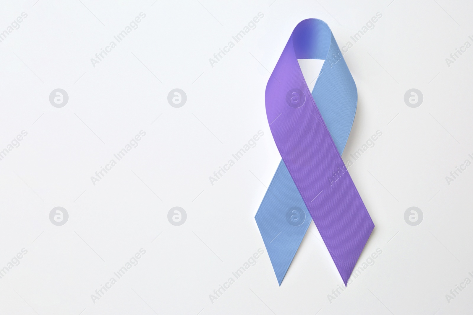 Image of World Arthritis Day. Blue and purple awareness ribbon on white background, top view. Space for text