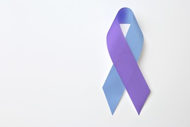 Image of World Arthritis Day. Blue and purple awareness ribbon on white background, top view. Space for text