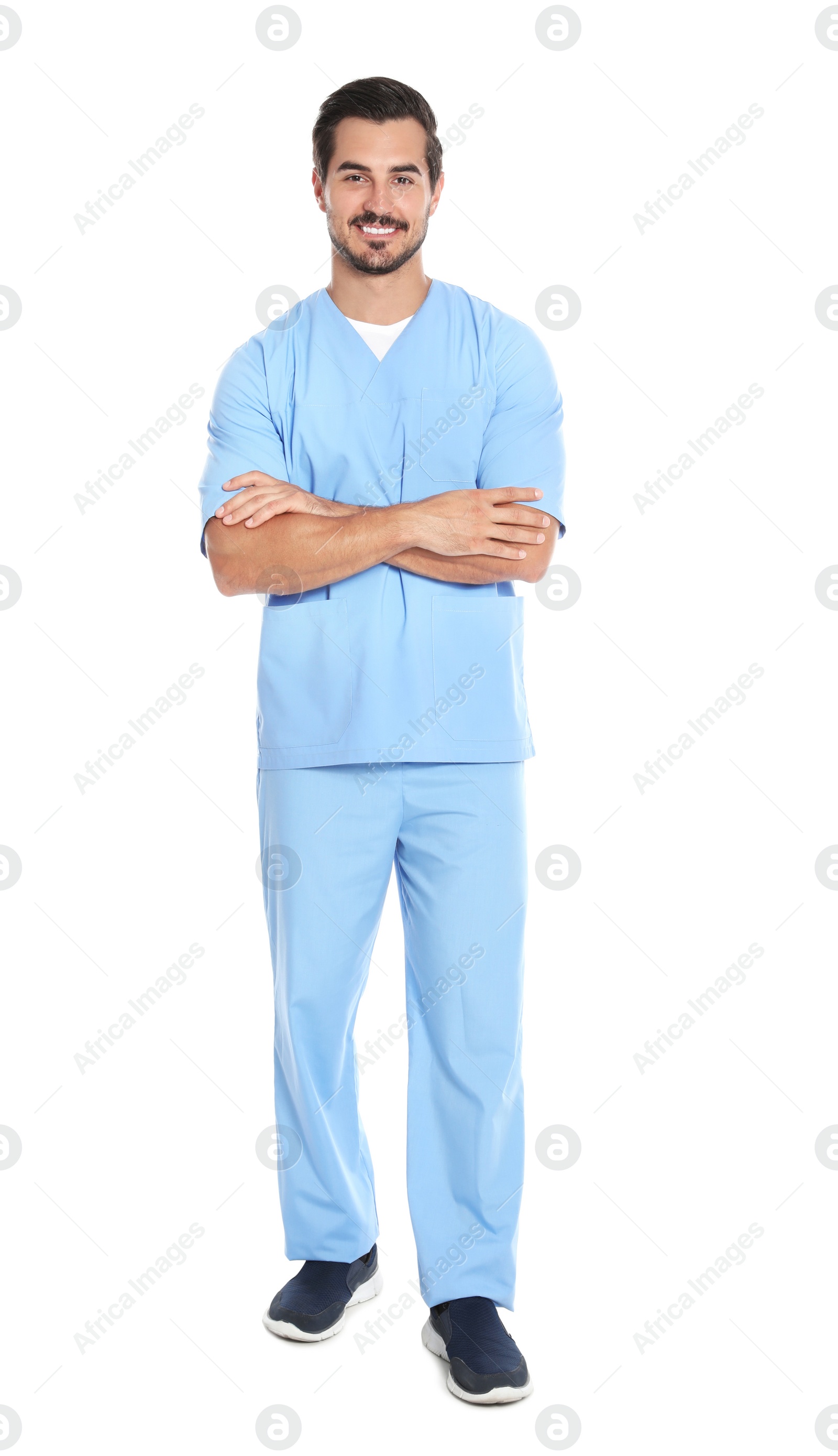 Photo of Young male doctor in uniform on white background. Medical service