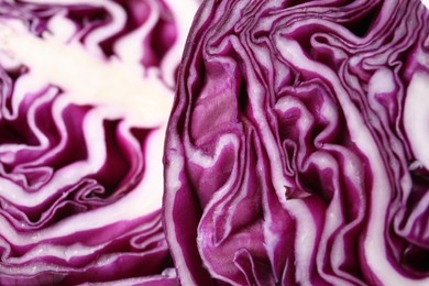 Photo of Cut fresh red cabbage as background, closeup