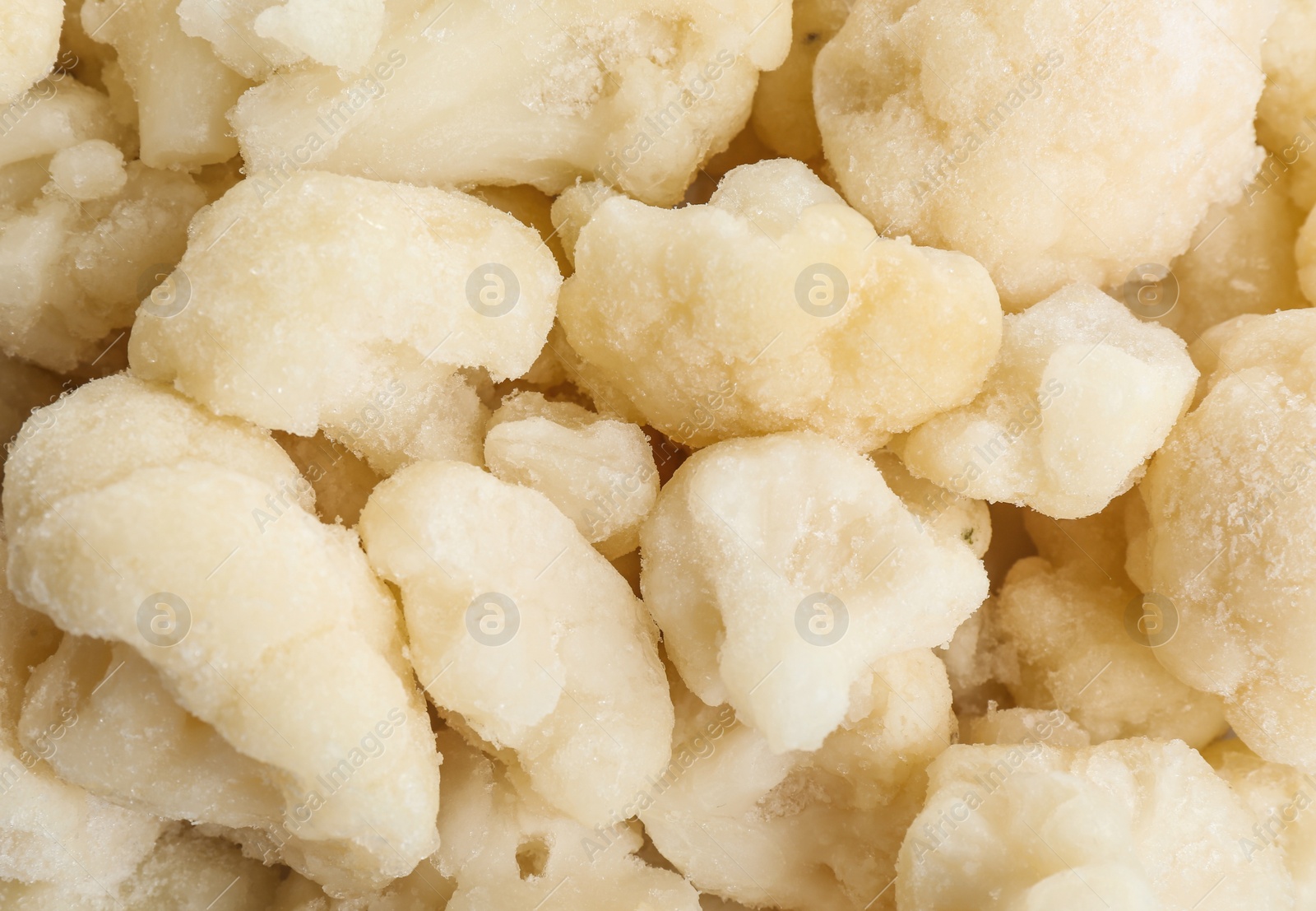 Photo of Frozen cauliflower florets as background, top view. Vegetable preservation