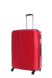 Photo of Red suitcase for travelling on white background