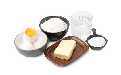 Photo of Eggs, butter, flour, salt and water isolated on white. Ingredients for puff pastry dough