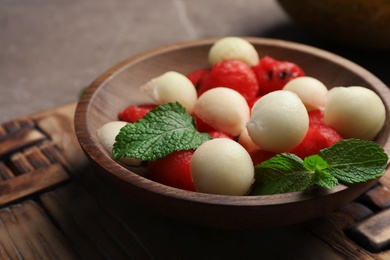 Photo of Plate with melon and watermelon balls on table