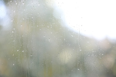 Photo of View of glass with water drops, closeup