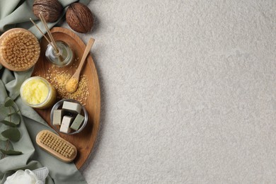 Photo of Composition with different spa products and reed air freshener on light grey textured table, top view. Space for text